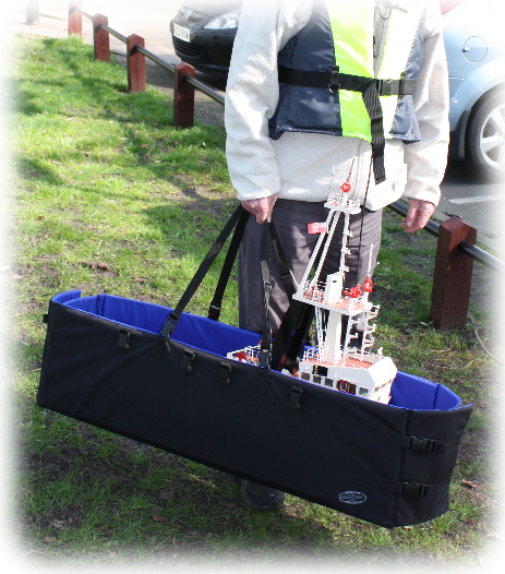 The boat carrier shows how easy it is to carry a 45" tug in one hand