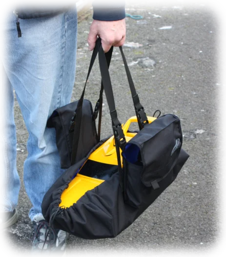 Easy carry Club 500 race boat with pouches containing the transmitter and spare batteries