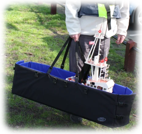 The boat carrier shows how easy it is to carry a 45" tug in one hand